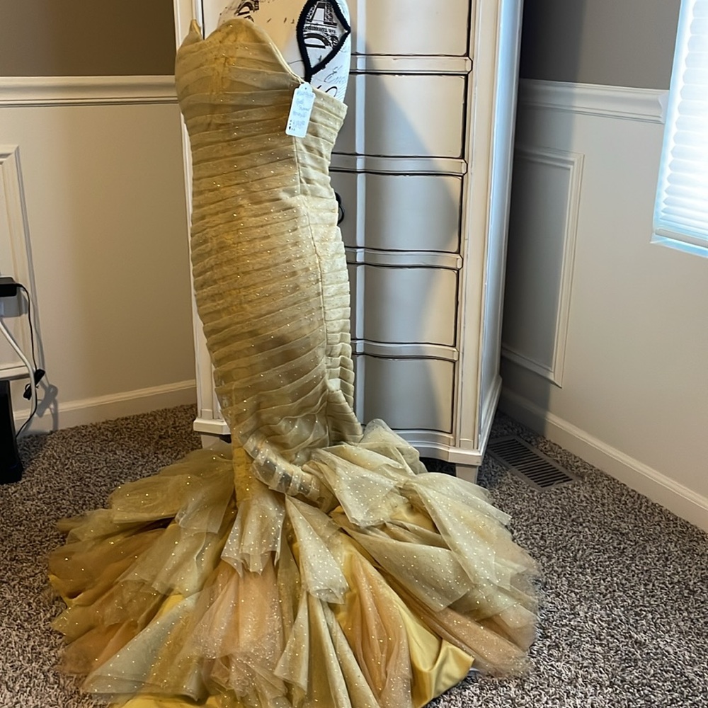 Gold strapless mermaid-style formal gown with a ruffled tulle skirting - Picture 7 of 11